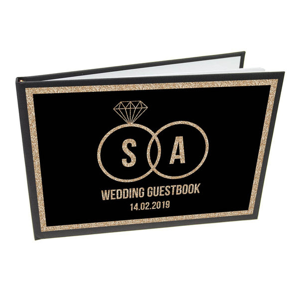 Personalisiertes Hochzeitsgästebuch mit schwarzen und goldenen Ringen